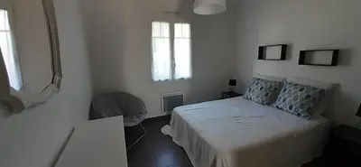 Un ou plusieurs lits dans un hébergement de l'établissement MAISON ROUGE LE PONANT
