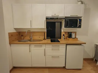 Cuisine ou kitchenette dans l'établissement Échappée Cosy au Cœur du Futuroscope - Confort Assurés