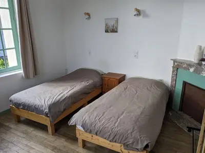 Un ou plusieurs lits dans un hébergement de l'établissement Appartement le Vigeant