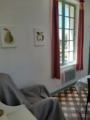 Coin salon dans l'établissement Appartement le Vigeant