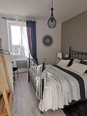 Un ou plusieurs lits dans un hébergement de l'établissement 'Quelle Belle Vue' Chambre d'Hote