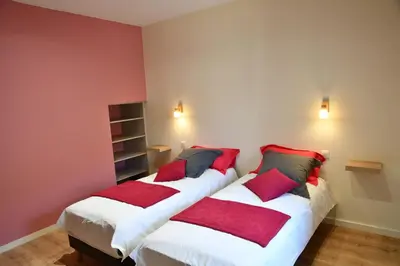 Un ou plusieurs lits dans un hébergement de l'établissement Grande maison de vacances Les Reinettes