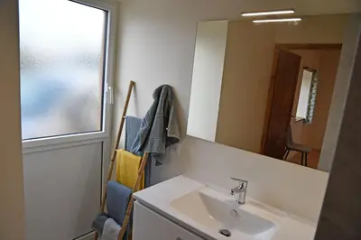 Salle de bains dans l'établissement Grande maison de vacances Les Reinettes