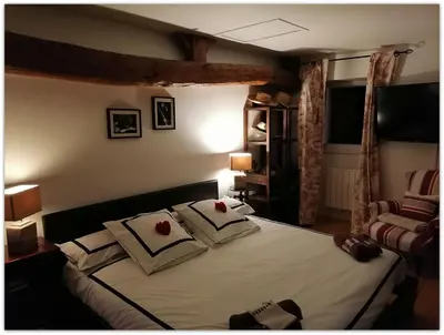 Un ou plusieurs lits dans un hébergement de l'établissement Une Chambre d'Hôtes dans charmante longère Charentaise