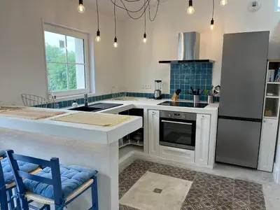 Cuisine ou kitchenette dans l'établissement Le Clos de Flo