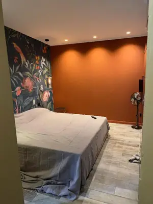 Un ou plusieurs lits dans un hébergement de l'établissement Les Chambres de Marc