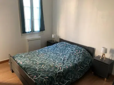 Un ou plusieurs lits dans un hébergement de l'établissement Appartement vu maison Pierre Loti