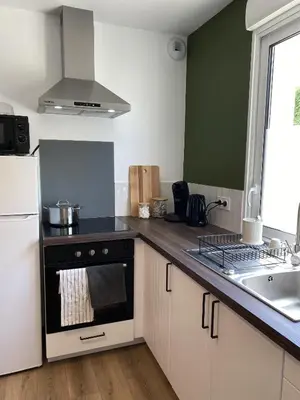Cuisine ou kitchenette dans l'établissement Le Cinquième
