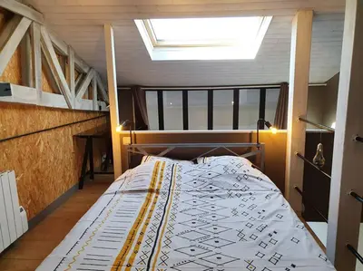 Un ou plusieurs lits dans un hébergement de l'établissement APPARTEMENT CENTRE VILLE AU CALME JARDIN et PARKING PUBLIC