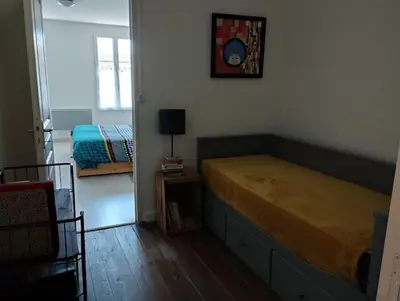 Un ou plusieurs lits dans un hébergement de l'établissement Charmante maison à Corme-Royal