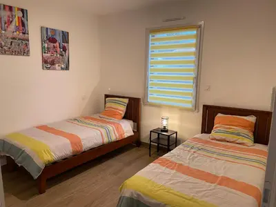 Un ou plusieurs lits dans un hébergement de l'établissement maison la rochelle 3 étoiles