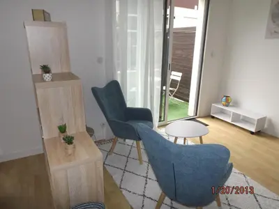 Coin salon dans l'établissement LA ROCHELLE MIRANDE T1BIS