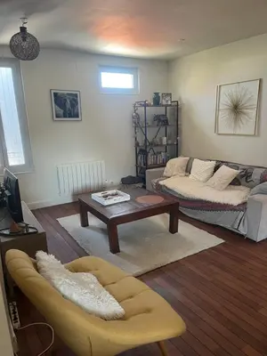 Coin salon dans l'établissement Appartement chaleureux au cœur de la ville
