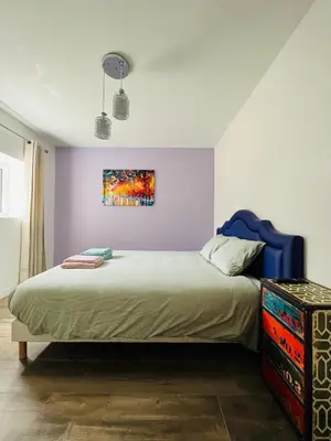 Un ou plusieurs lits dans un hébergement de l'établissement maison chaleureuse ,avec piscine, spa, Futuroscope