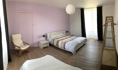 Un ou plusieurs lits dans un hébergement de l'établissement Maison de vacances familiale au cœur du marais poitevin