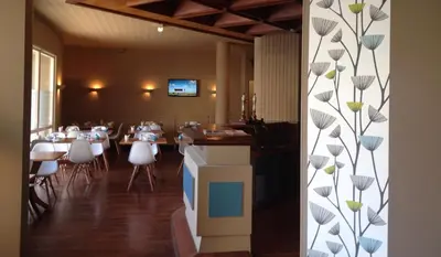 Télévision ou salle de divertissement dans l'établissement Moka Hotel