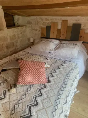 Un ou plusieurs lits dans un hébergement de l'établissement Le petit lodge cosy