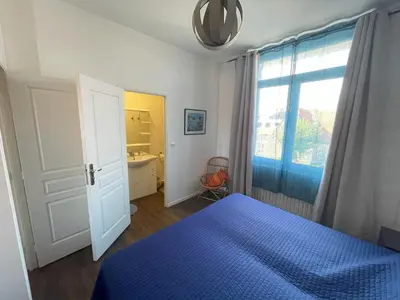 Un ou plusieurs lits dans un hébergement de l'établissement Maison de plage