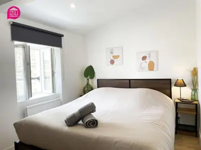 Un ou plusieurs lits dans un hébergement de l'établissement La Brèche Niortaise by CozyLife - Centre Ville- Gare