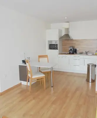 Cuisine ou kitchenette dans l'établissement Domitys Le Château des Plans