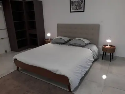 Un ou plusieurs lits dans un hébergement de l'établissement Maison neuve de standing 150 m2
