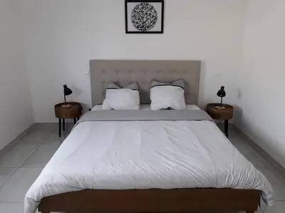 Un ou plusieurs lits dans un hébergement de l'établissement Maison neuve de standing 150 m2