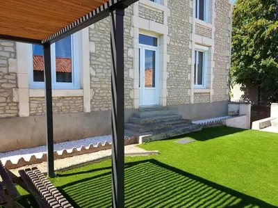 Jardin de l'établissement Appartement lumineux proche Futuroscope
