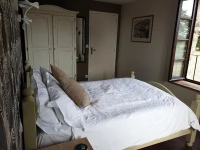 Un ou plusieurs lits dans un hébergement de l'établissement La Maison du Lac Lavaud