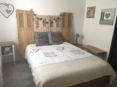 Un ou plusieurs lits dans un hébergement de l'établissement Maison d'hôtes cosy & agréable à 5min du Futuroscope