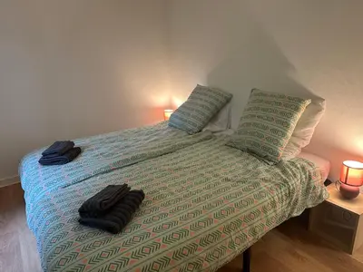 Un ou plusieurs lits dans un hébergement de l'établissement Maison paisible, 15 min du Futuroscope & Arena.