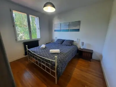 Un ou plusieurs lits dans un hébergement de l'établissement Maison au Calme, prés du centre Parking Privé