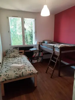 Un ou plusieurs lits dans un hébergement de l'établissement Maison au Calme, prés du centre Parking Privé