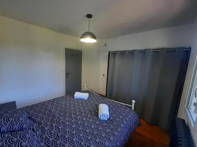 Un ou plusieurs lits dans un hébergement de l'établissement Maison au Calme, prés du centre Parking Privé