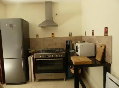Cuisine ou kitchenette dans l'établissement Les Chouettes Blanches