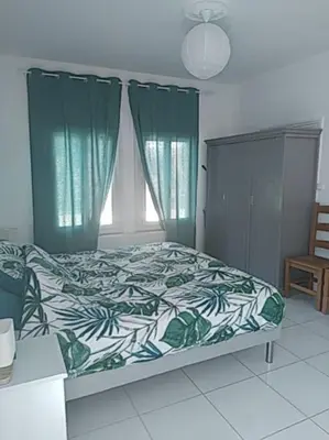 Un ou plusieurs lits dans un hébergement de l'établissement Le spiti, maison agréable avec stationnement privatif