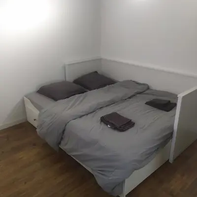 Un ou plusieurs lits dans un hébergement de l'établissement Appartement indépendant, calme 2 adultes, 2 étoiles