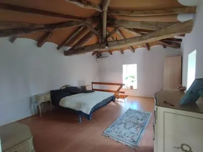 Un ou plusieurs lits dans un hébergement de l'établissement Cottage chaleureux au calme