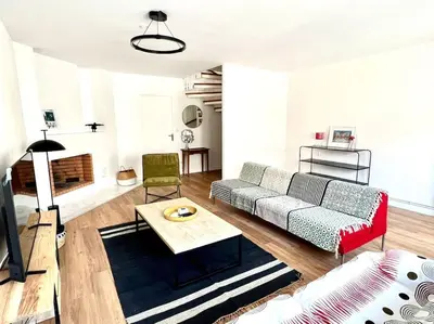 Coin salon dans l'établissement Superbe appartement avec parking