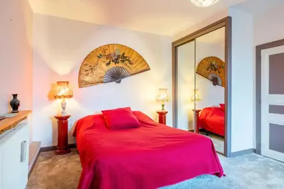 Un ou plusieurs lits dans un hébergement de l'établissement Chambre Nuit d'Asie
