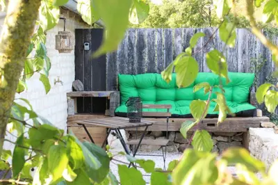 Coin salon dans l'établissement Studio confort, charme & tranquilité 