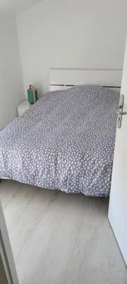 Un ou plusieurs lits dans un hébergement de l'établissement Appartement proche Futuroscope