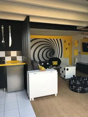 Coin salon dans l'établissement Au 29 logement cocon avec jacuzzi privatif