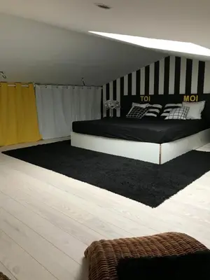 Un ou plusieurs lits dans un hébergement de l'établissement Au 29 logement cocon avec jacuzzi privatif