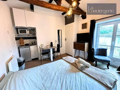 Un ou plusieurs lits dans un hébergement de l'établissement Le Studio Augouard - Calme &Cosy