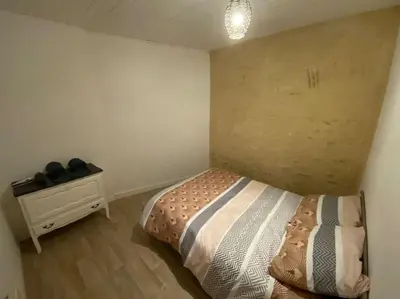 Un ou plusieurs lits dans un hébergement de l'établissement Petite maison plain-pied climatisé