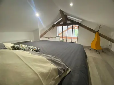 Un ou plusieurs lits dans un hébergement de l'établissement Maison de charme - proche Futuroscope