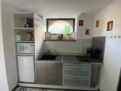Cuisine ou kitchenette dans l'établissement Maison de charme - proche Futuroscope
