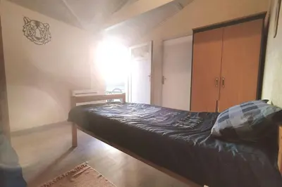 Un ou plusieurs lits dans un hébergement de l'établissement Gîte du Midi de Saint-Porchaire - Charmante maison de vacances avec piscine chauffée
