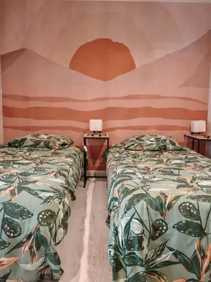 Un ou plusieurs lits dans un hébergement de l'établissement MaisonnetteAu36-centre-parking-cosy