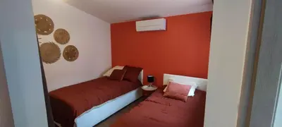 Un ou plusieurs lits dans un hébergement de l'établissement Charmante maison de plain-pied